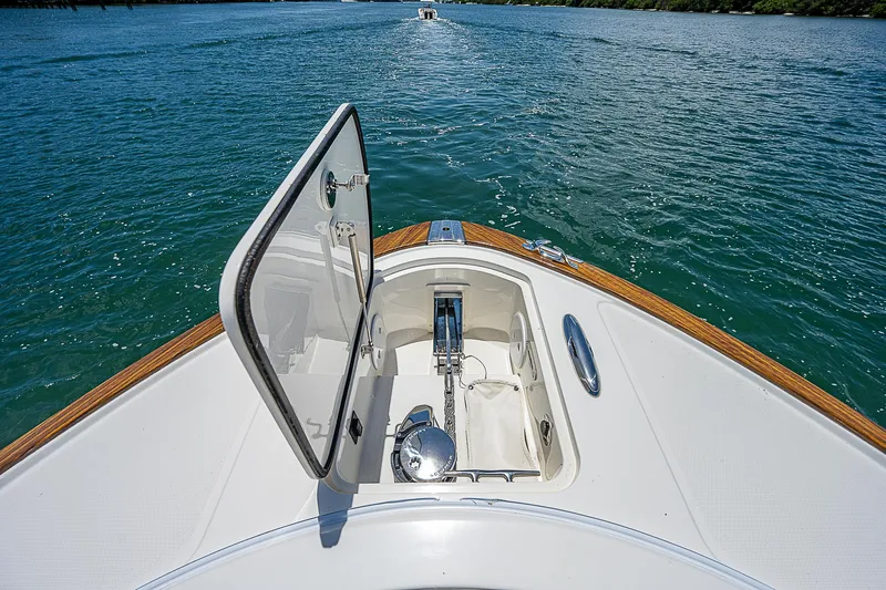Tropical Breeze Yacht Photos Pics Hinckley Sport Boat 40 C 2020, open hatch on deck, cruising on clear blue water.