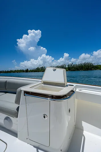 Tropical Breeze Yacht Photos Pics 2020 Hinckley Sport Boat 40 C, sleek design, open water, clear sky, luxury boating experience.