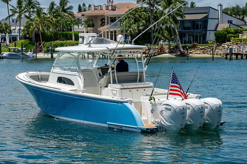 Tropical Breeze Yacht Photos Pics 2020 Hinckley Sport Boat 40 C on water, featuring triple outboard engines.