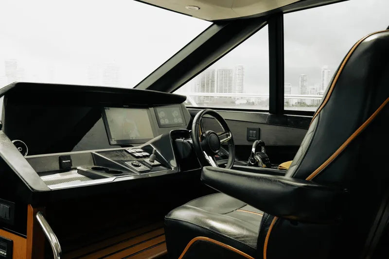 Amaray Yacht Photos Pics Luxurious 2020 Princess S62 yacht helm with modern controls and leather seating.