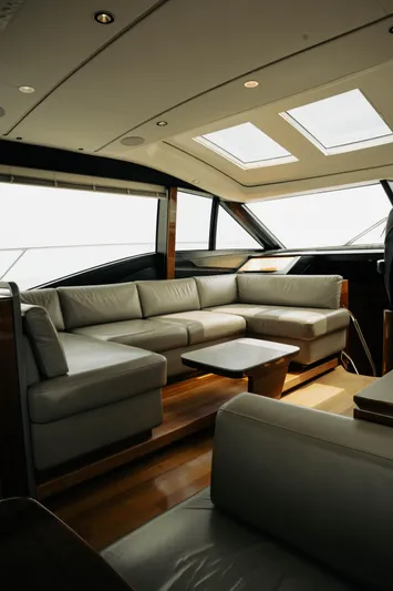 Amaray Yacht Photos Pics Luxurious interior of 2020 Princess S62 yacht with elegant seating and skylights.