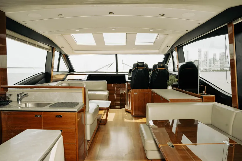 Amaray Yacht Photos Pics Luxurious interior of a 2020 Princess S62 yacht with modern furnishings and panoramic windows.