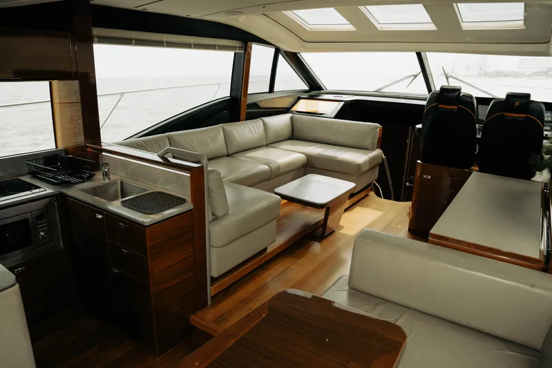 Amaray Yacht Photos Pics Luxurious interior of 2020 Princess S62 yacht with modern furnishings and panoramic windows.