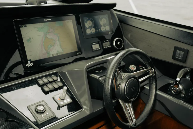Amaray Yacht Photos Pics Cockpit of 2020 Princess S62 yacht with navigation screens and steering wheel.