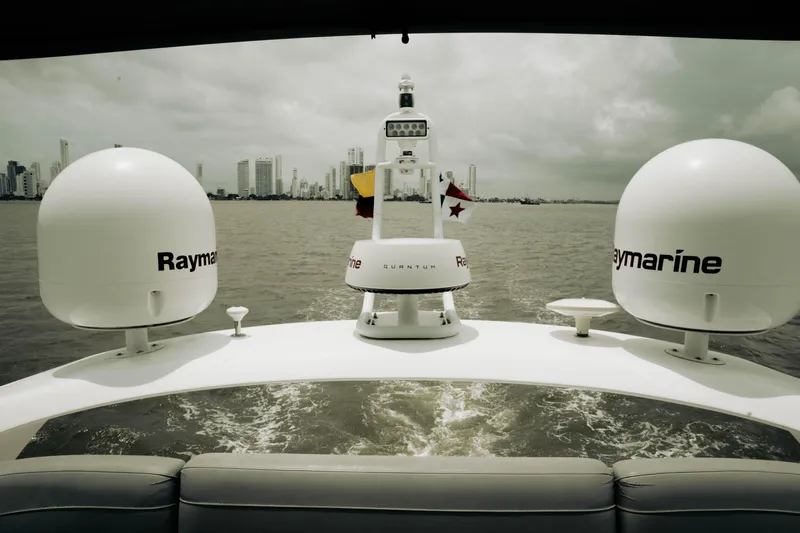 Amaray Yacht Photos Pics 2020 Princess S62 yacht with Raymarine equipment, cruising near city skyline.