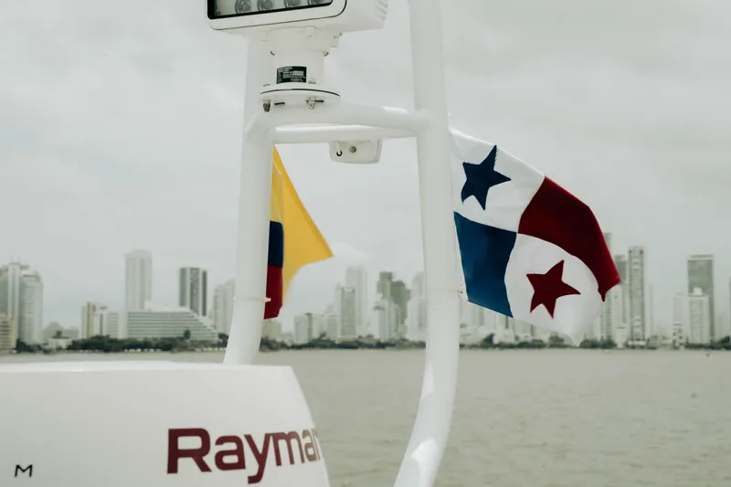 Amaray Yacht Photos Pics Boat with Panama and Colombia flags, city skyline in background, Princess S62, 2020 model.