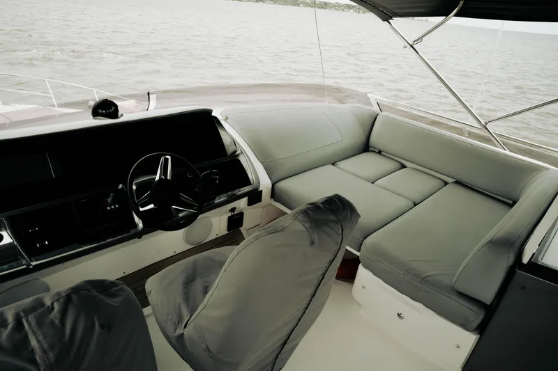 Amaray Yacht Photos Pics Interior of 2020 Princess S62 yacht with sleek helm and comfortable seating.