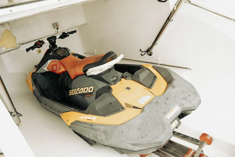 Amaray Yacht Photos Pics Orange Sea-Doo jet ski stored in a 2020 Princess S62 yacht compartment.