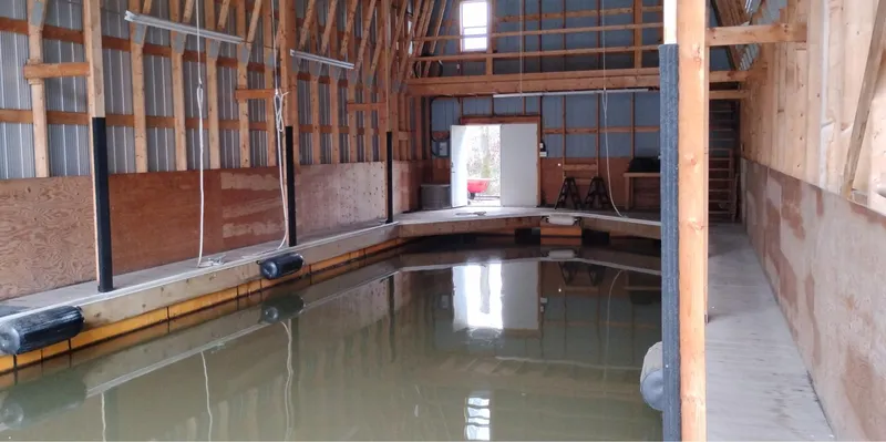  Yacht Photos Pics Custom 2012 boathouse interior with wooden beams and indoor water dock.