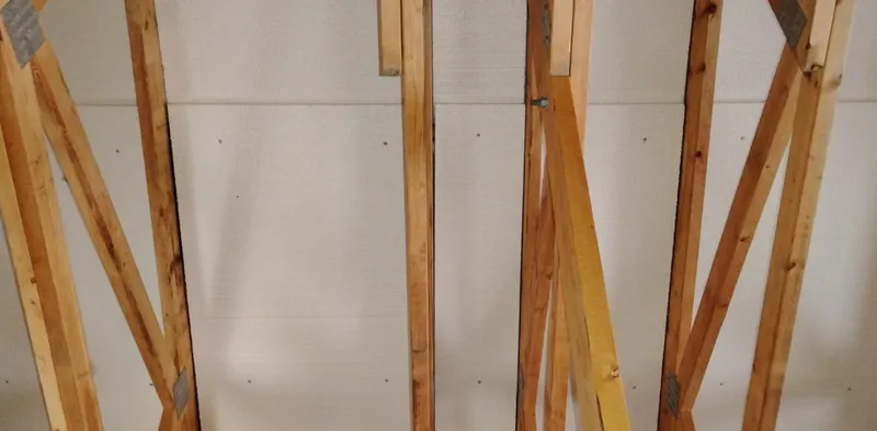  Yacht Photos Pics Wooden framework of a custom boathouse model, 2012, showcasing structural design elements.