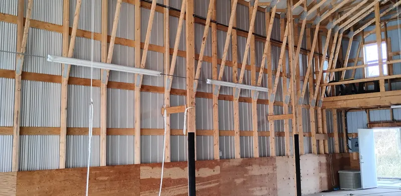  Yacht Photos Pics Interior of a custom boathouse with wooden beams and corrugated metal walls, built in 2012.