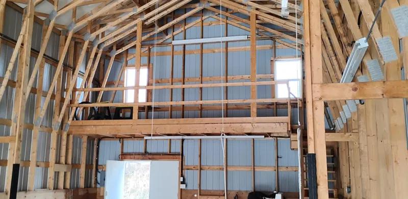  Yacht Photos Pics Interior of a custom boathouse with wooden beams and metal walls, built in 2012.
