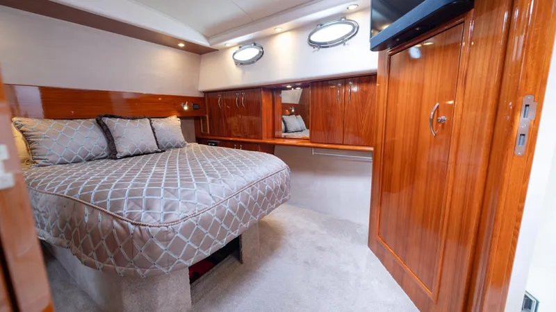 Unchained Freedom Yacht Photos Pics Luxurious cabin interior of 2007 Maritimo M60 Cruising Motor Yacht with elegant wood finishes.