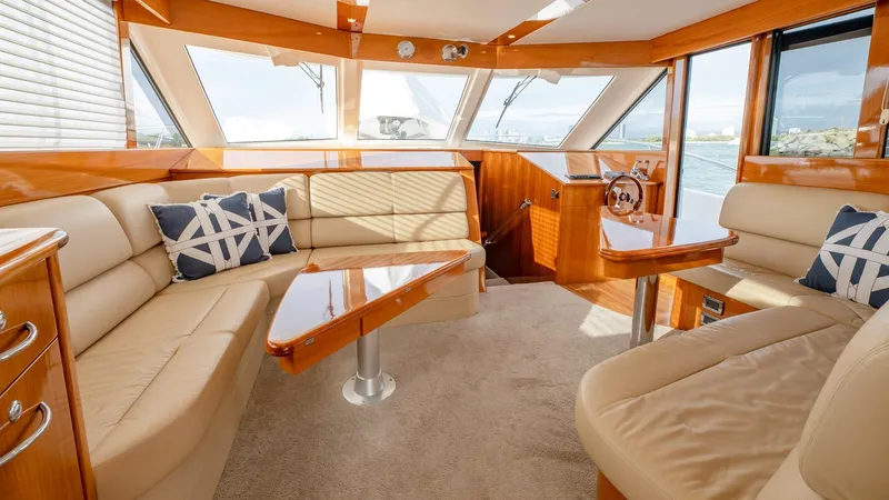 Unchained Freedom Yacht Photos Pics Luxurious interior of 2007 Maritimo M60 Cruising Motor Yacht with plush seating and nautical decor.