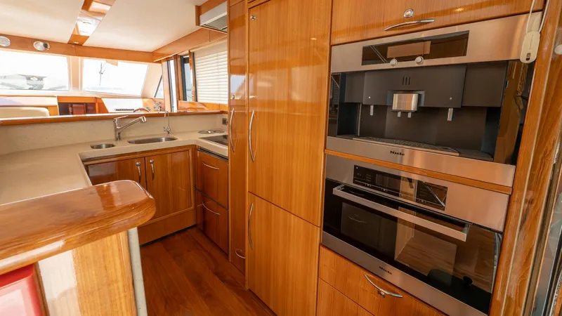 Unchained Freedom Yacht Photos Pics Luxurious kitchen interior of 2007 Maritimo M60 Cruising Motor Yacht with modern appliances.