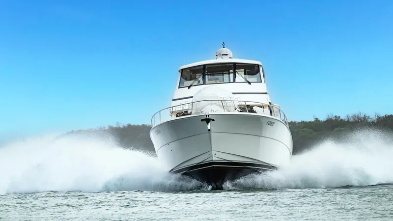 Unchained Freedom Yacht Photos Pics 2007 Maritimo M60 Cruising Motor Yacht speeding on water, front view.