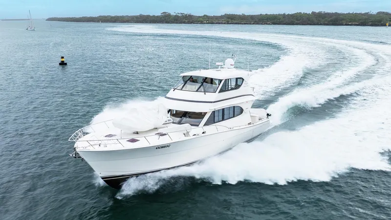 Unchained Freedom Yacht Photos Pics 2007 Maritimo M60 Cruising Motor Yacht speeding on open water.