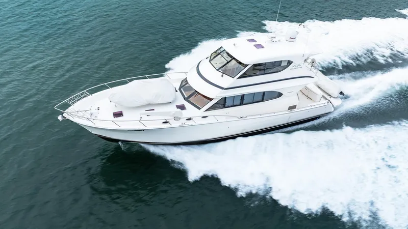 Unchained Freedom Yacht Photos Pics 2007 Maritimo M60 Cruising Motor Yacht speeding on open water.