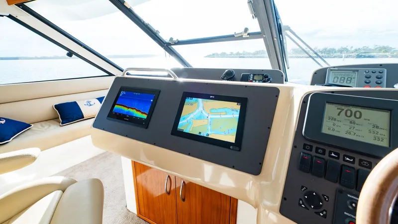 Unchained Freedom Yacht Photos Pics Helm of 2007 Maritimo M60 Cruising Motor Yacht with navigation screens and controls.