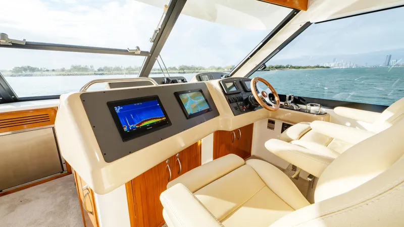 Unchained Freedom Yacht Photos Pics 2007 Maritimo M60 Cruising Motor Yacht cockpit with modern navigation displays and luxurious seating.