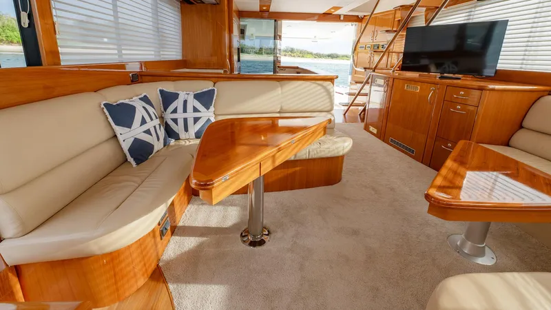 Unchained Freedom Yacht Photos Pics Luxurious interior of 2007 Maritimo M60 yacht with plush seating and elegant wood finishes.