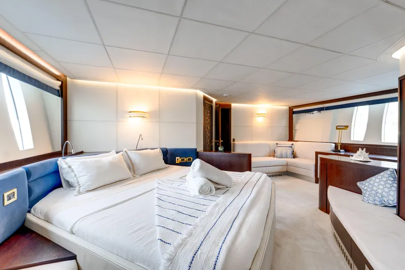 Ginger Yacht Photos Pics Luxurious 2006 Pershing 115 yacht interior with elegant bedroom and modern furnishings.