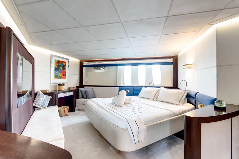 Ginger Yacht Photos Pics Luxurious bedroom interior on a 2006 Pershing 115 yacht, featuring modern design and elegant furnishings.