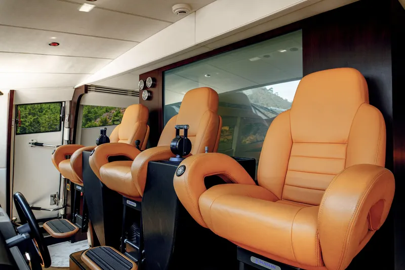 Ginger Yacht Photos Pics Luxurious orange leather seats inside a 2006 Pershing 115 yacht cockpit.