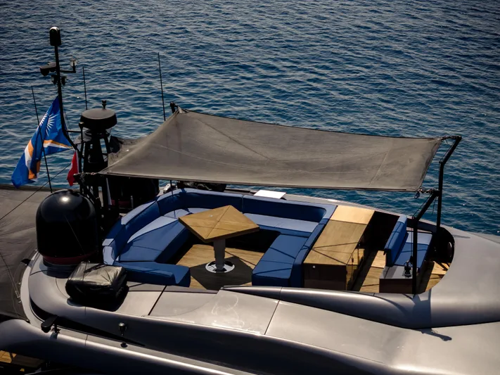 Ginger Yacht Photos Pics Luxurious 2006 Pershing 115 yacht deck with shaded seating area on calm blue waters.