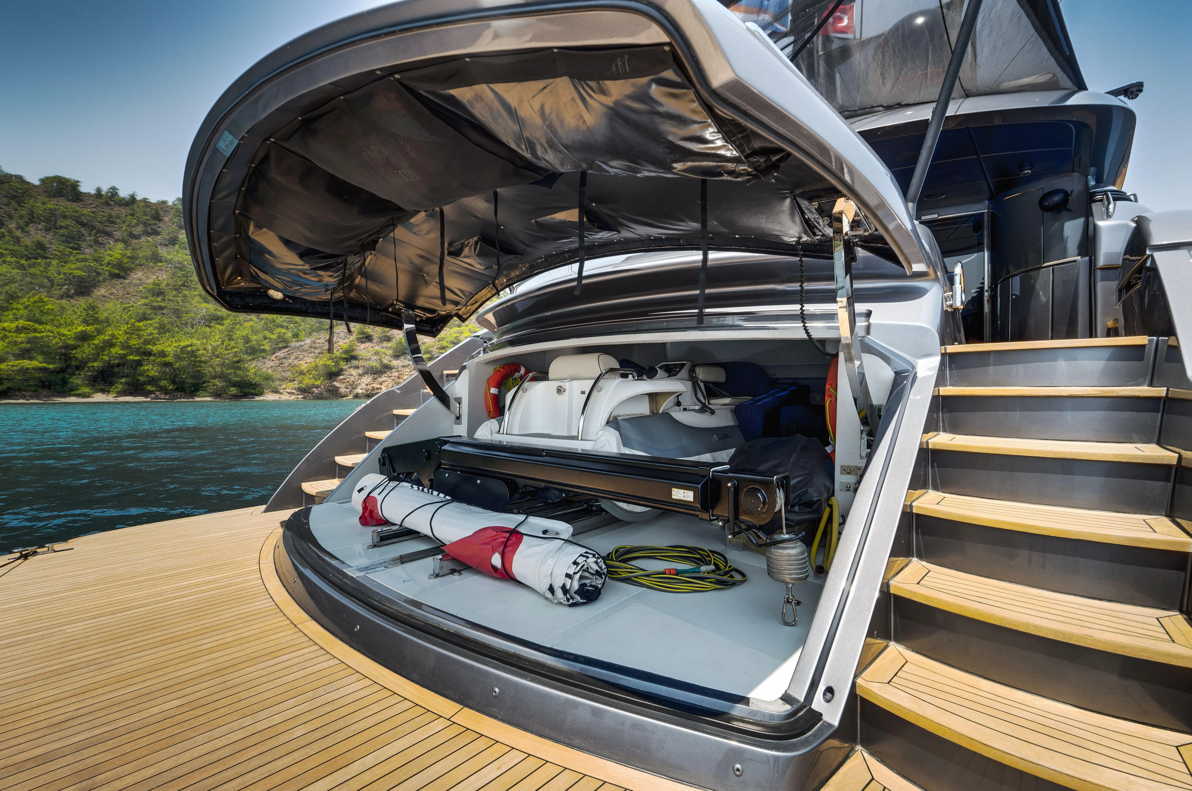 Ginger Yacht Photos Pics Open storage compartment on a 2006 Pershing 115 yacht, showcasing equipment and accessories.