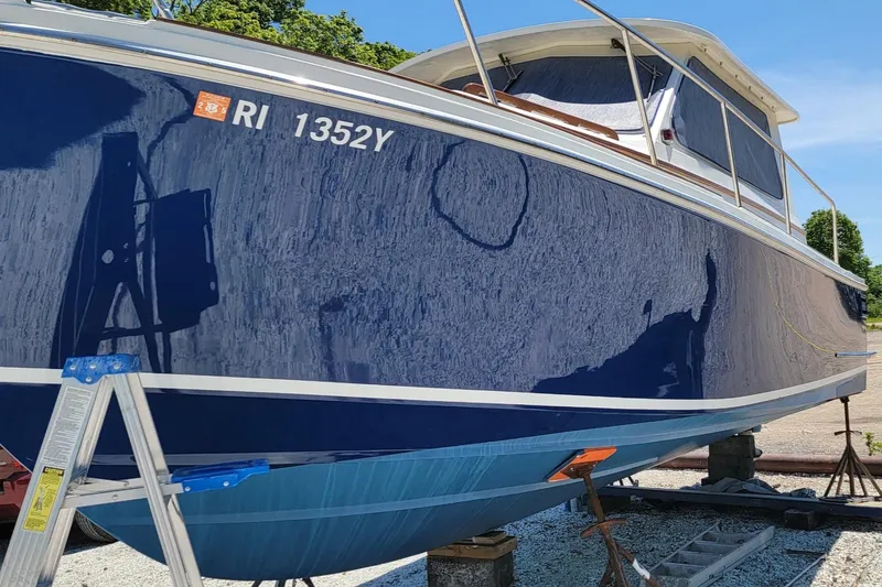  Yacht Photos Pics 2000 Hunt Yachts 29 boat on stands, blue hull, registration RI 1352Y.