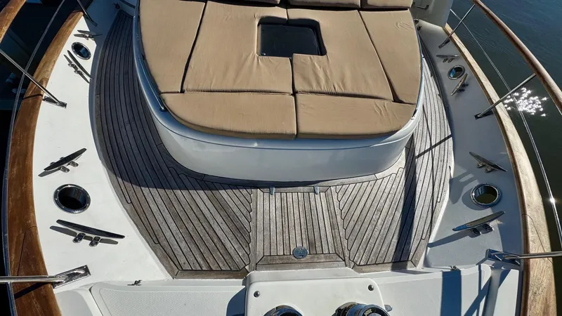 Bee Haven Yacht Photos Pics Fleming 65 Pilothouse Motor Yacht 2006, teak deck with cushioned seating area.