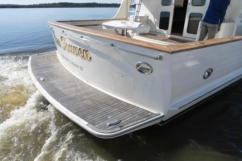 Bee Haven Yacht Photos Pics 2006 Fleming 65 Pilothouse Motor Yacht cruising on calm waters.