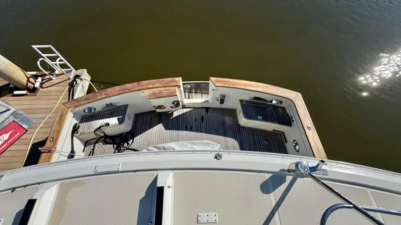 Bee Haven Yacht Photos Pics 2006 Fleming 65 Pilothouse Motor Yacht stern view at dock.