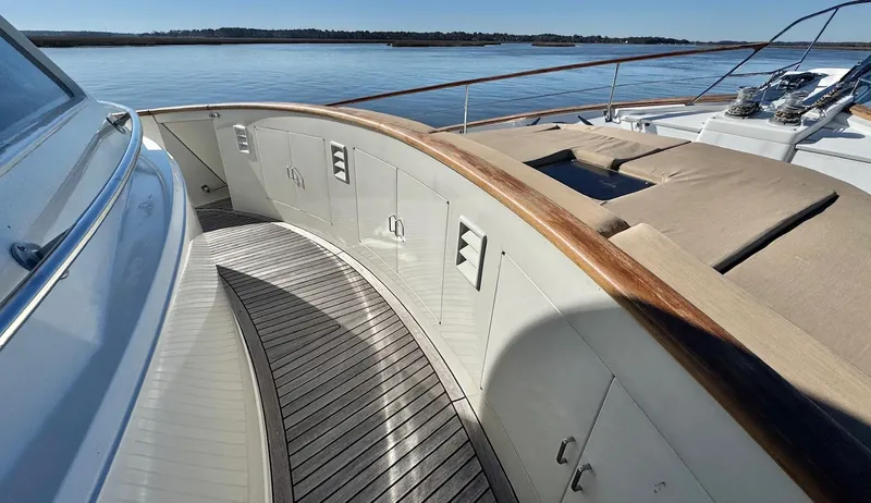 Bee Haven Yacht Photos Pics 2006 Fleming 65 Pilothouse Motor Yacht deck with wood trim and seating area.