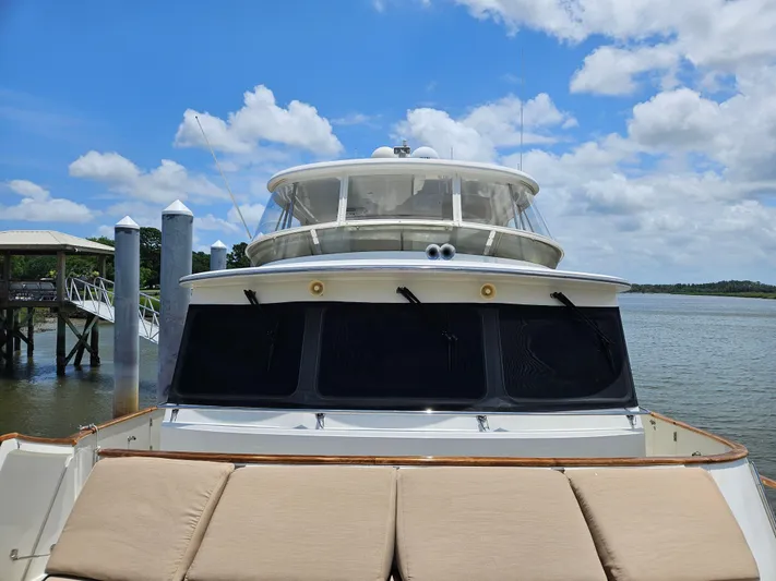 Bee Haven Yacht Photos Pics 2006 Fleming 65 Pilothouse Motor Yacht on a sunny day by the dock.