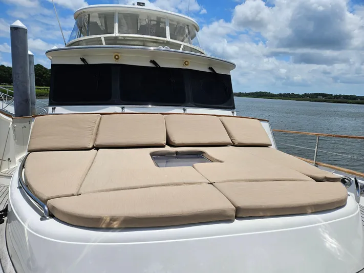 Bee Haven Yacht Photos Pics Fleming 65 Pilothouse Motor Yacht 2006 with sun deck cushions on a sunny day.