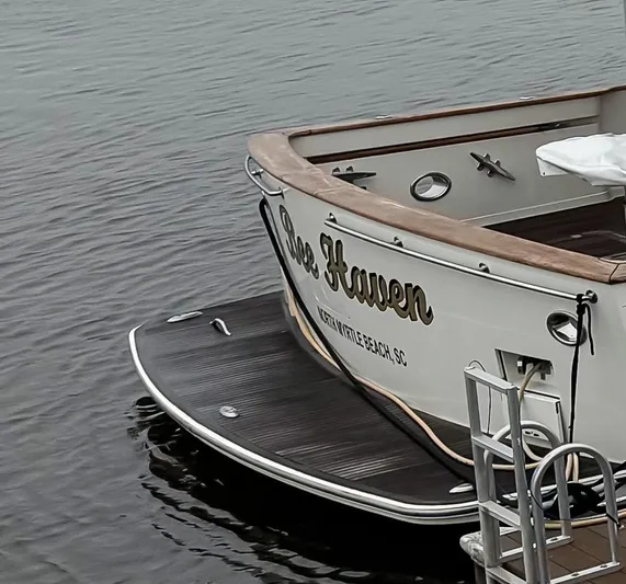 Bee Haven Yacht Photos Pics Fleming 65 Pilothouse Motor Yacht, 2006, docked in calm waters.