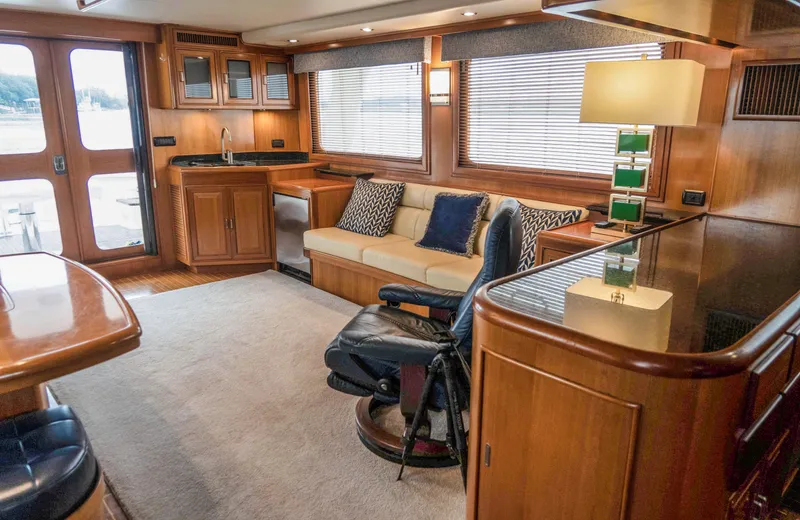 Bee Haven Yacht Photos Pics Luxurious interior of 2006 Fleming 65 Pilothouse Motor Yacht with elegant wood finishes.