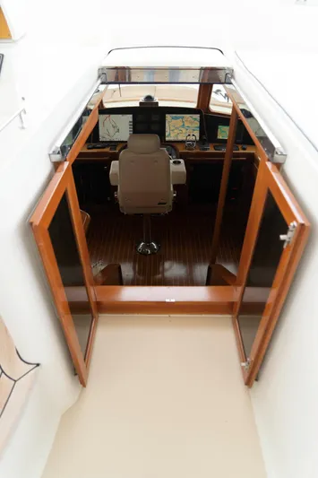 Bee Haven Yacht Photos Pics Pilothouse interior of 2006 Fleming 65 Motor Yacht with navigation equipment.