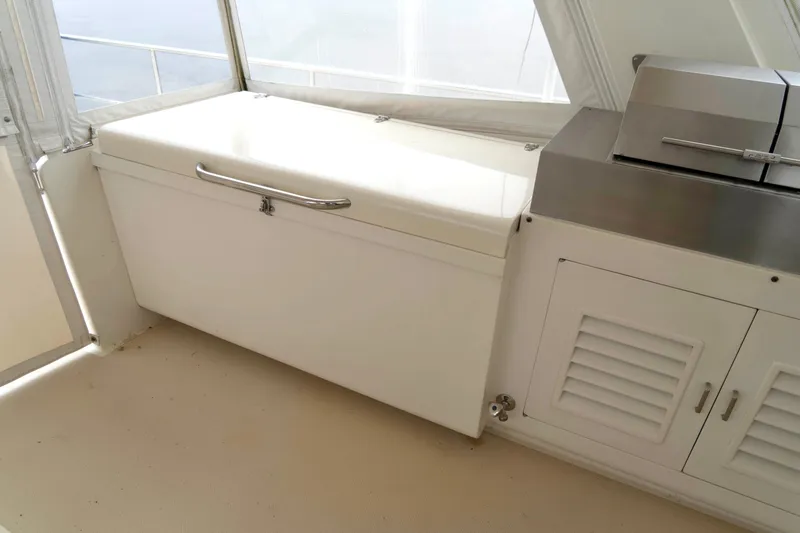 Bee Haven Yacht Photos Pics White storage unit and grill on 2006 Fleming 65 Pilothouse Motor Yacht deck.