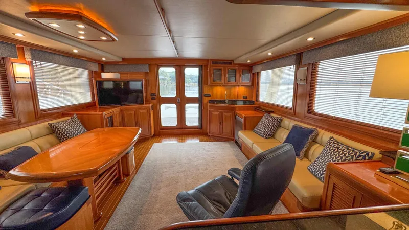 Bee Haven Yacht Photos Pics Luxurious interior of 2006 Fleming 65 Pilothouse Motor Yacht with elegant wood finishes.
