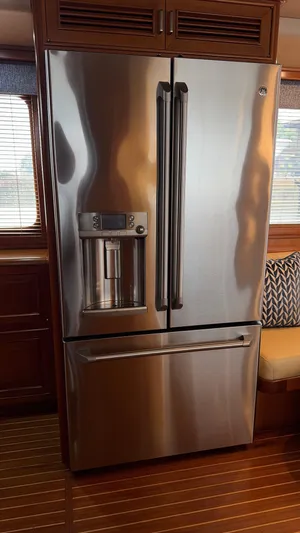 Bee Haven Yacht Photos Pics Stainless steel refrigerator in 2006 Fleming 65 Pilothouse Motor Yacht interior.