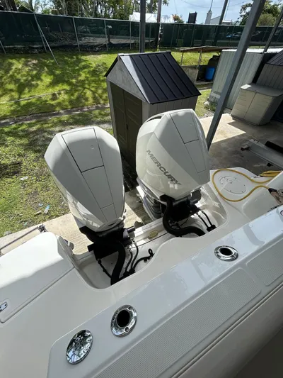  Yacht Photos Pics 2022 Boston Whaler 325 Conquest with dual Mercury outboard engines, docked outdoors.