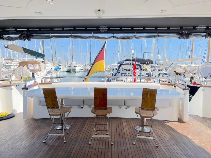 Curiosity Yacht Photos Pics Luxurious Elegance 82 S yacht deck with bar stools, marina view, 2001 model.