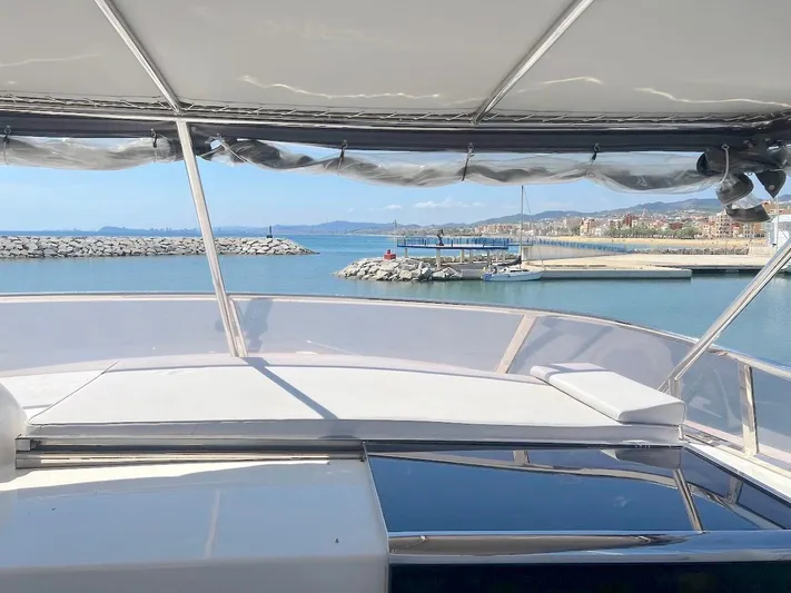 Curiosity Yacht Photos Pics Luxury yacht Elegance 82 S, 2001 model, docked with scenic ocean view.