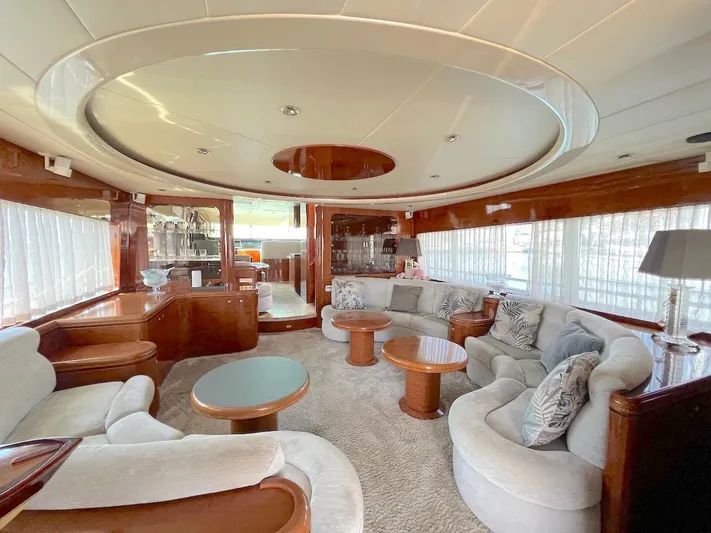 Curiosity Yacht Photos Pics Luxurious yacht interior with plush seating, wooden accents, and elegant decor, Elegance 82 S, 2001 model.