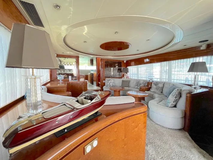 Curiosity Yacht Photos Pics Luxurious yacht interior with elegant furnishings, featuring a model boat, by Elegance 82 S, 2001.
