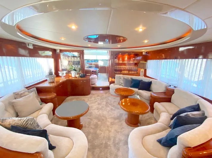 Curiosity Yacht Photos Pics Luxurious interior of 2001 Elegance 82 S yacht with plush seating and elegant decor.
