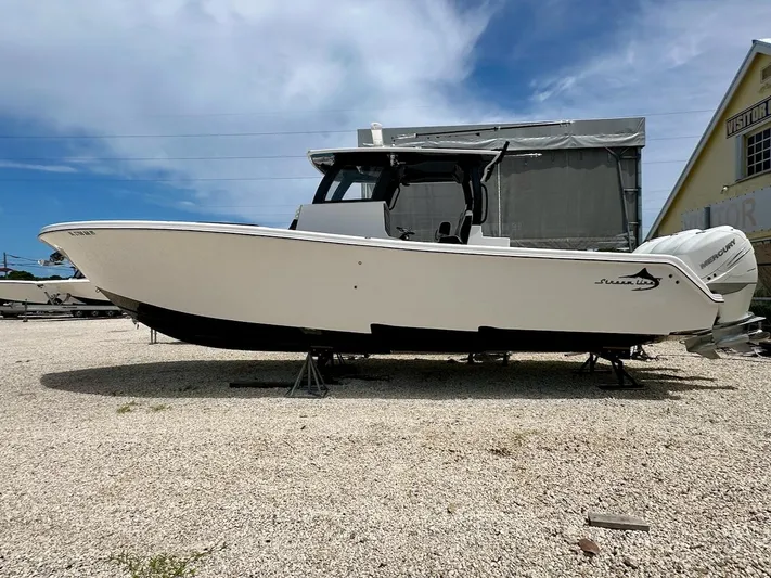  Yacht Photos Pics 2021 Streamline 35CC boat on display, white hull, outdoor setting, clear sky background.